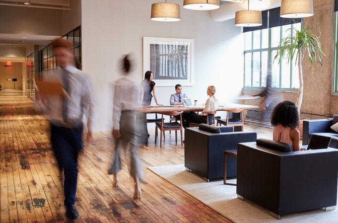 Interior of commercial building with clients interacting with employees