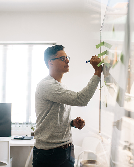 Employee writing on a whiteboard