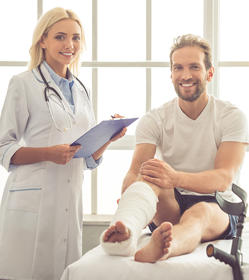 disability-insurance Doctor standing next to patient with a wrapped leg