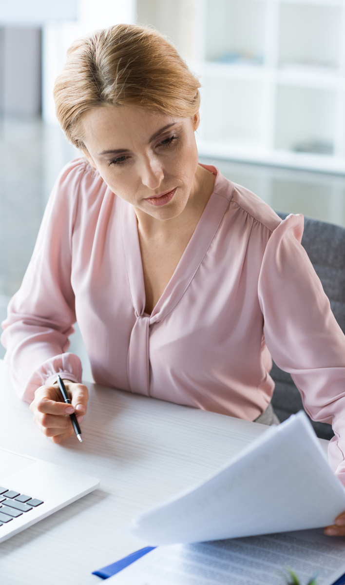 life-insurance2 Employee reading life insurance documents