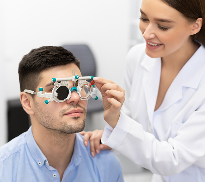 optometrist testing the vision of a patient