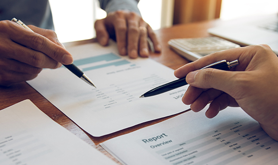 PrestigePEO_Transparent_Pricing_0422 This is an image of people writing on pieces of paper that indicates report. It's an image to represent how busy our clients are and for visual representation of the content on the webpage.