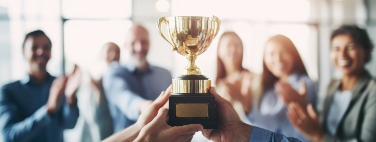011715 - PrestigePEO Growth and Milestones Blog Artwork PrestigePEO Growth and Milestones - business people holding award and cheering