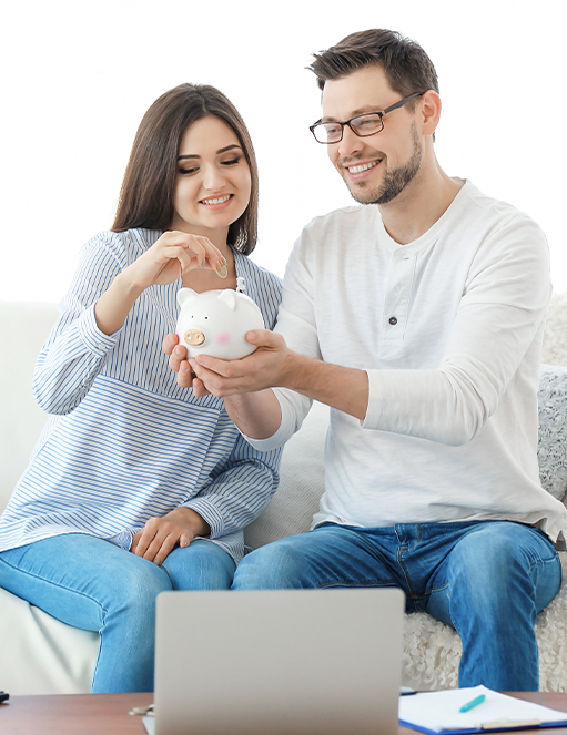 Services - Retirement Planning Couple saving money using a piggy bank